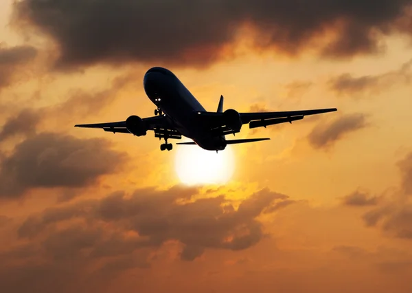 Silhouette airplane with the sun — Stock Photo, Image