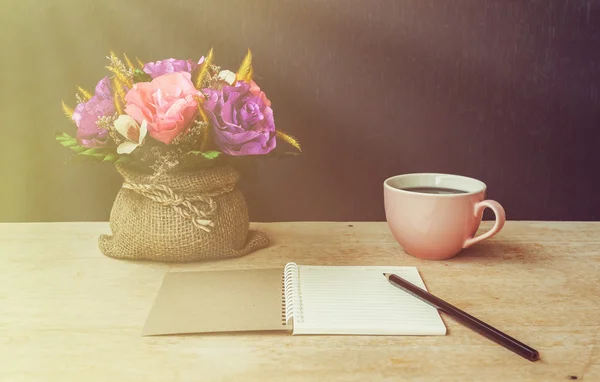 Table of writer, Notepad with pencil and artificial flower