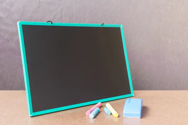 School chalkboard with chalk — Stock Photo, Image