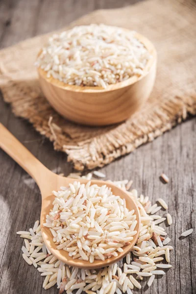 Rice berry or rice berries in wooden spoon — Stock Photo, Image