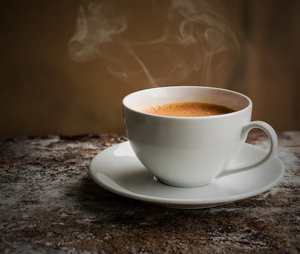 Cup of coffee with smoke in still life ton — Stok fotoğraf