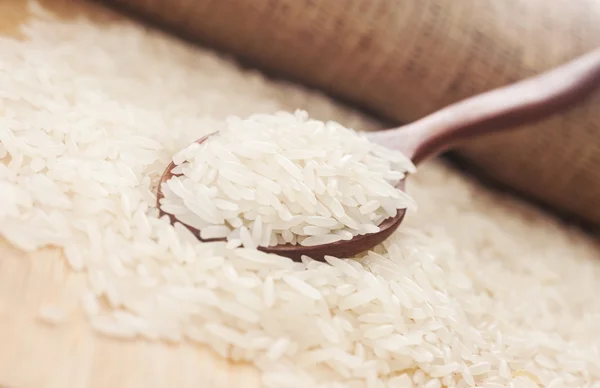 Rice, White rice in wooden spoon — Stock Photo, Image