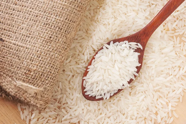 Rice, White rice in wooden spoon with hemp — Stock Photo, Image