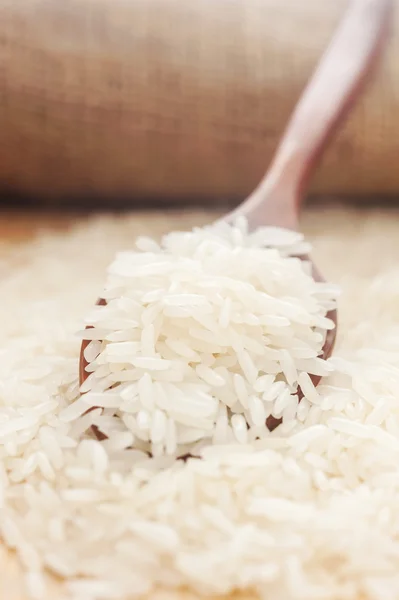 Rice, White rice in wooden spoon with hemp — Stock Photo, Image