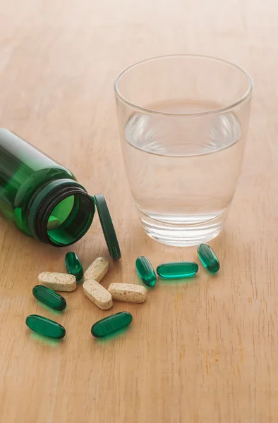 Pills spilling out of a bottle — Stock Photo, Image