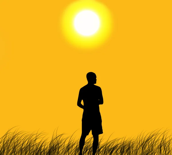 Silhouet de man ontspannen met kleur van de zonsondergang — Stockfoto