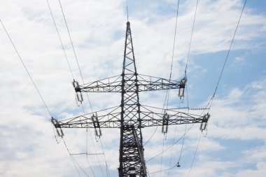 closeup of power pilon against the blue sky