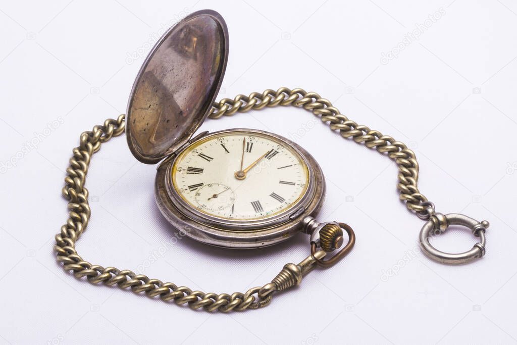 old pocket watch with white background