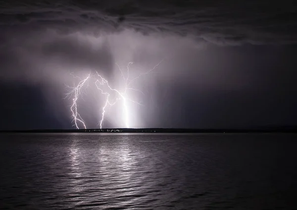 thunderstorm at night in the lake