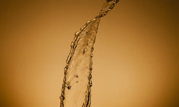 Текстура воды на золотом фоне — стоковое фото