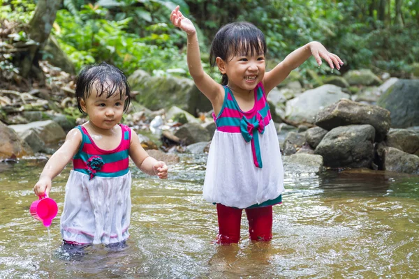 Asian Little Chinese Girls Playing in Creek