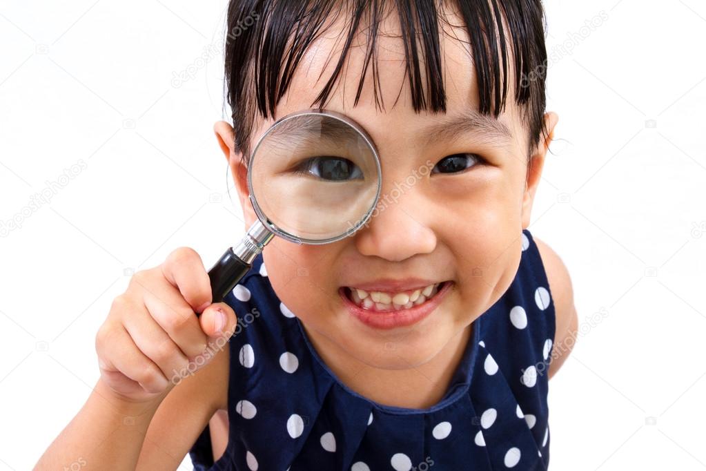 Asian Little Chinese Girl Holding Magnifying Glass 