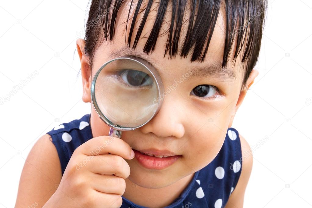 Asian Little Chinese Girl Holding Magnifying Glass 