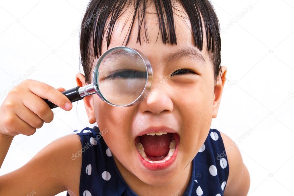 Asian Little Chinese Girl Holding Magnifying Glass 