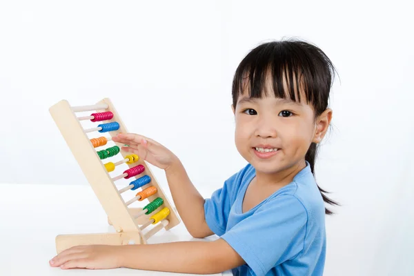 Asian Little Chinese Girl Playing Colorful Abacus Stock Photo