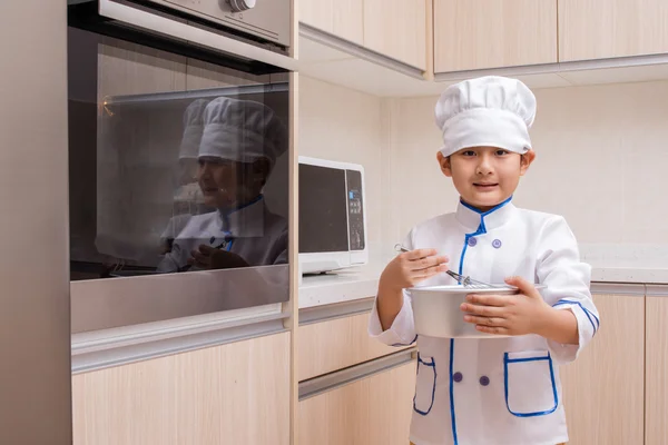 Asian Chinese Boy in white chef uniform Baking Cookies — Stock Photo, Image