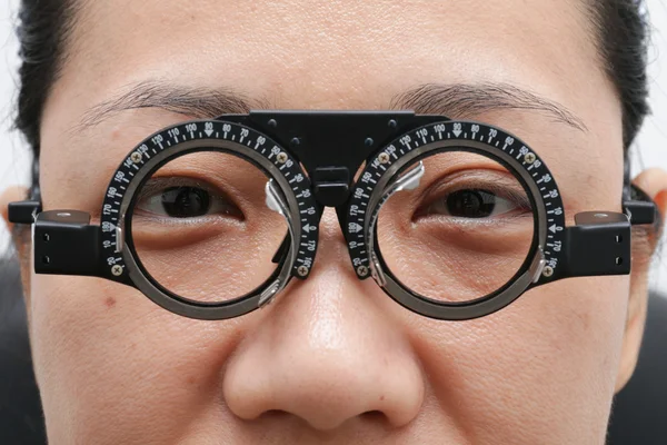 Asian Woman Doing Eyes Examination