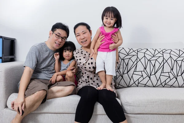 Portrait of Happy Asian Chinese Family Sitting on Couch