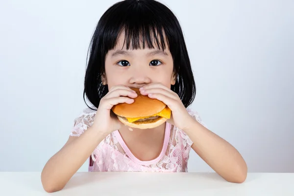 Asian Chinese little girl Eating Burger — Stock Photo, Image