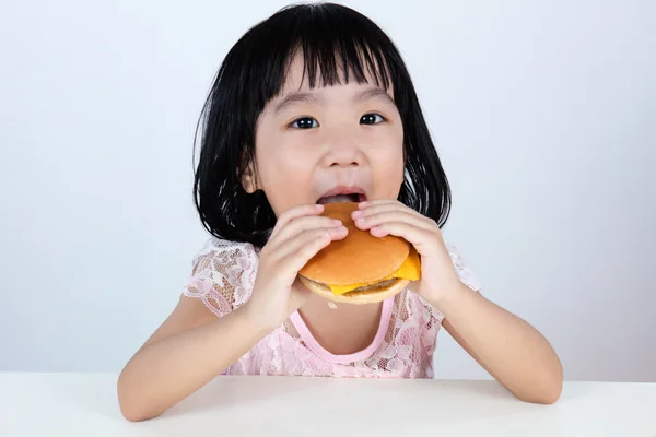 Happy Asian Chinese little girl Eating Burger — Stock Photo, Image