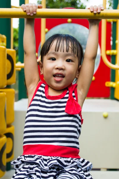 Asian Kid Hanging on bar — Stock Photo, Image