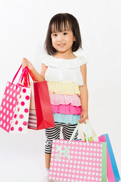 Asian Kid with shopping bag — Stock Photo, Image