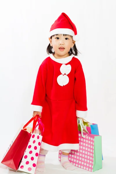 亚洲小圣诞老人提着购物袋 — 图库照片