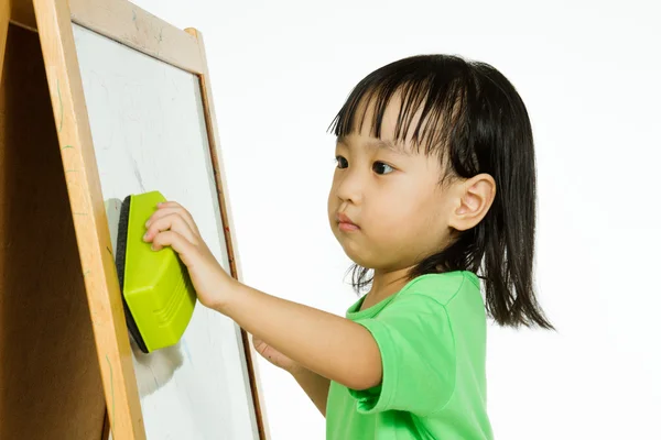 Chinese little girl writing on whiteboard — Stock Photo, Image