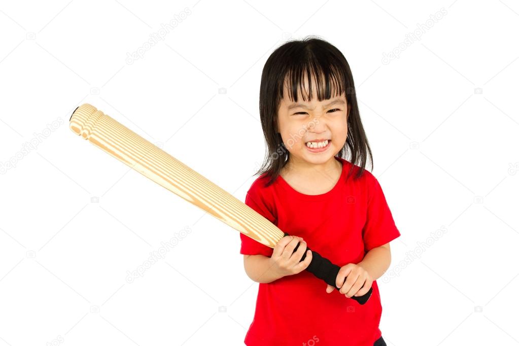 Chinese little girl holding baseball bat with angry expression