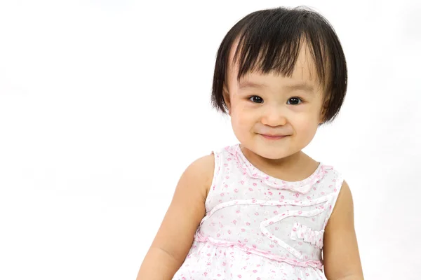 Kínai kis lány mosolyog a stúdióban portré — Stock Fotó