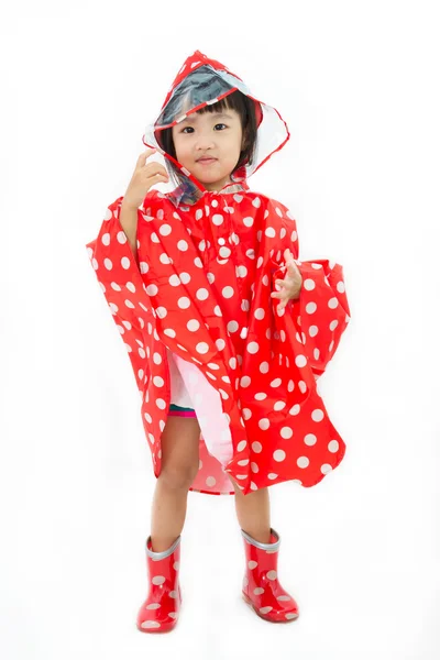 Menina chinesa vestindo capa de chuva e botas — Fotografia de Stock