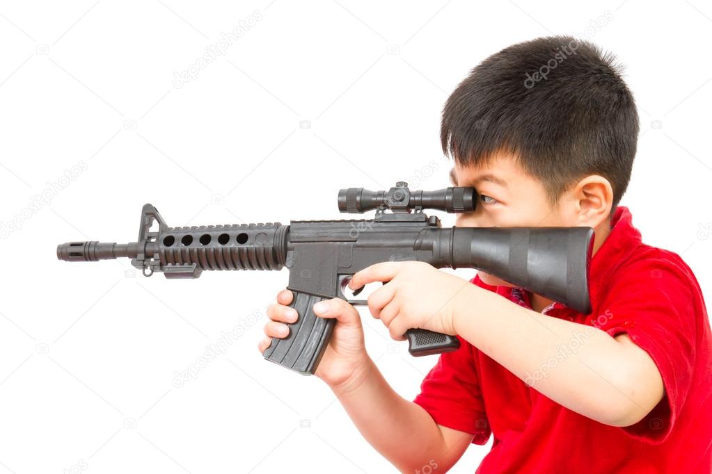 Asian Little Boy Playing Plastic Toy AK47