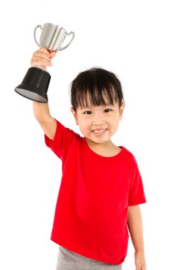 Asian Little Chinese Girl Smiles with a Trophy in Her Hands clipart