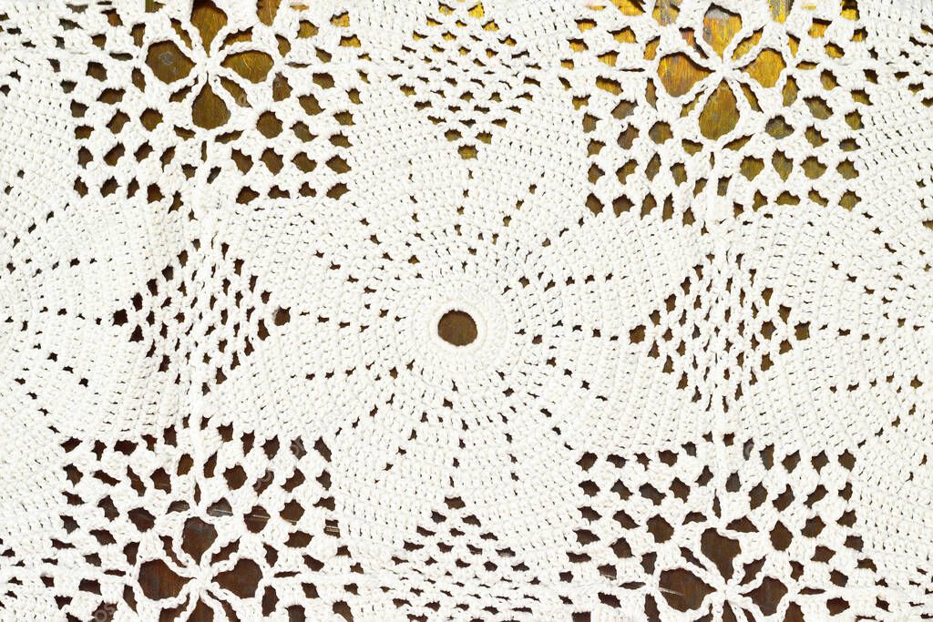 Top view of crochet lace doily tablecloth