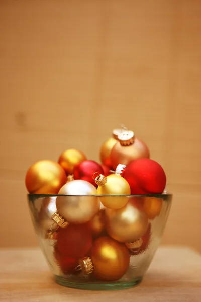 Christmas baubles in bowl — Stock Photo, Image