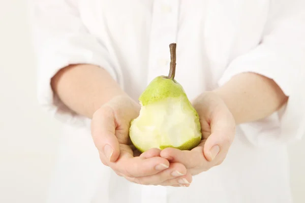Hands holding pear — Stock Photo, Image