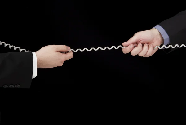 Tug of war with phone cord — Stock Photo, Image