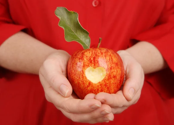 Delicious Apple with heart bitten out — Stock Photo, Image