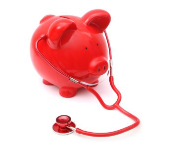 red piggy bank with stethescope