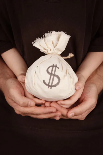 Money bag in family hands — Stock Photo, Image