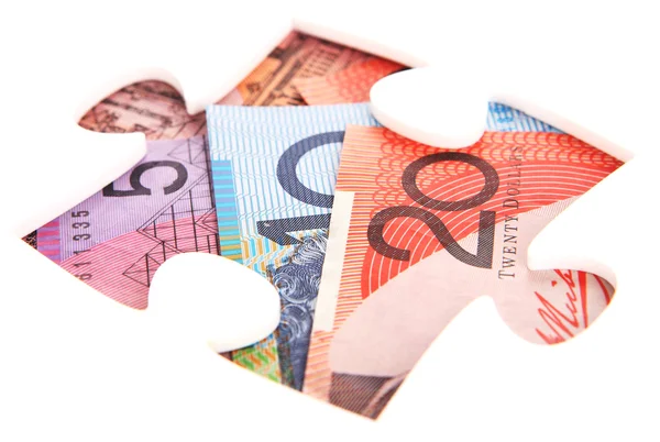 Jigsaw puzzle hole with Australian Money — Stok fotoğraf