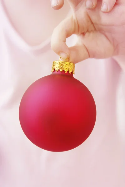 Hand with Christmas bauble — Stock Photo, Image