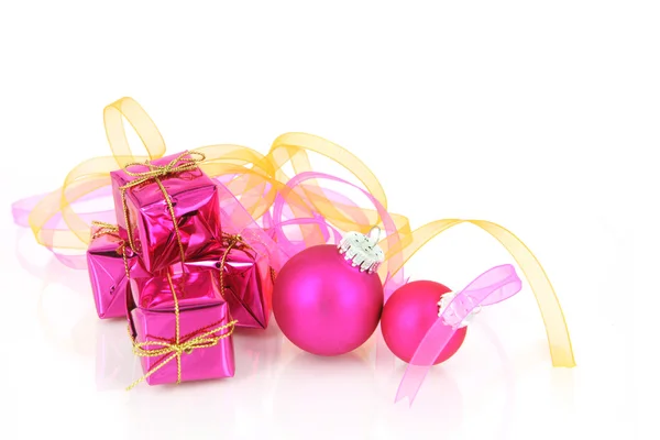 Pink gift boxes and christmas baubles — Zdjęcie stockowe
