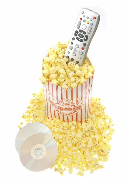 Scatola di popcorn con telecomando e cd — Foto Stock