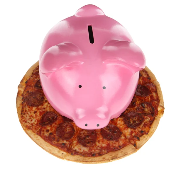 Pink piggy bank on pizza — Zdjęcie stockowe