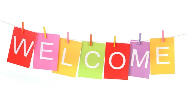 Welcome word on colored paper sheets Stock Image