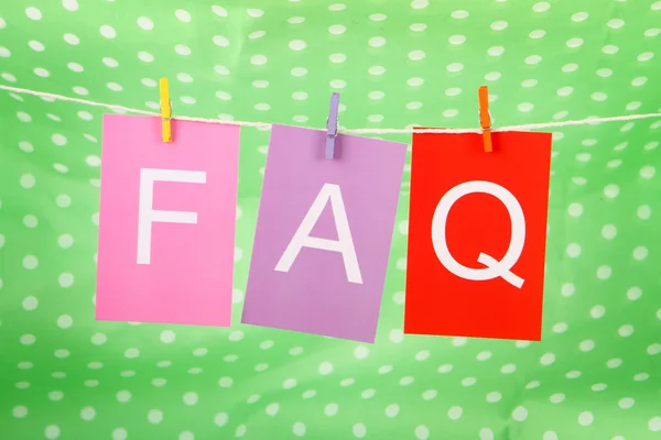 Faq word on colored paper sheets Royalty Free Stock Images