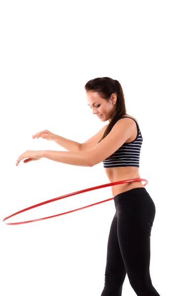 Chica haciendo hula hoop Imágenes de stock libres de derechos