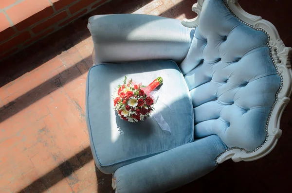 Bridal bouquet in soft antique chair — Stock Photo, Image