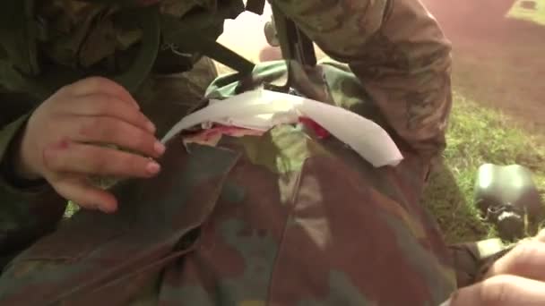 Military Training Soldier Prepares Care Stomach Wound — Stock Video